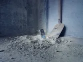 Device in dirt with shovel.
