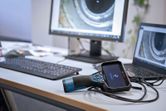 Inspection camera connected to a laptop and monitor on an office desk.